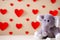 Will you be my valentine elephant with hearts in the background