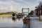 Willebroek, Belgium - May 27, 2019:  Large river barge sailing under the famous iron drawbridge of Willebroek