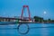 Willemsbrug in rotterdam at night with moonlight behind