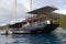 The William Thornton Floating Bar & Restaurant schooner, an old steel ship about 100 feet long, The Bight, Norman Island, BVI