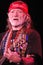 Willie Nelson in Red Bandana Playing Guitar