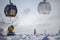 Willingen, Germany - February 7th, 2018 - Ski run with gondola lift and snow cannon shooting clouds of powdery snow