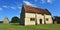 Willington Stables and Dovecot on a sunny day.