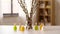 Willow and candles in shape of easter eggs at home