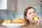 Willpower on a diet. The right choice - a woman eats a healthy apple against the background of harmful fast food