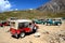 Willys jeeps parked on mountainside valley in Pakistan