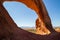 Wilson Arch, a natural sandstone arch located 24 miles south of Moab, Utah. Amazing view looking down into the valley