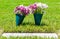 Wilted flowers at a grave marker in a veterans cemetery