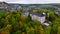 Wiltz, Luxembourg. Aerial shot at autumn of Wiltz Castle. Cloudy Weather Drone Footage