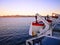 Winch and lifeboat of a blue and white ferry