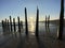 Winchelsea beach landscape view low tide exposing flat sand with wooden sea groynes protruding from the sand