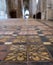 Winchester UK. Close up of the medieval encaustic floor tiles in the south isle of the retrochoir at Winchester Cathedral