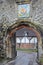 WINCHESTER, UK - FEBRUARY 5, 2017: The Priory Gate with Coat of Arms at the entrance of the old city