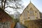 WINCHESTER, UK: A walkway with colorful walls leading to a church located on St Michaels Passage