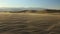 Wind blowing on sand dunes