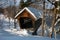 Wind Blowing Snow Around Covered Bridge