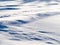 Wind drift snow flying over snow surface refief