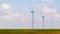 Wind energy turbines are one of the cleanest, renewable electric energy source, under blue sky with white clouds