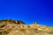 Wind eroded square hills, minarets, peaks, Efege mounds. Clean blue sky.