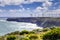 Wind farm built on rugged ocean coastline in Australia.