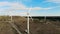 Wind farm drone view. High wind turbines working, close up.
