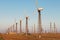 Wind farm, many turbo generators stand in a row, alternative wind energy