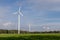 Wind farm on an open field. A windmill that generates electricit