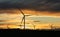 Wind farm silhouette. Wind turbine farm at sunset