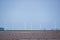 Wind farm Turbines shimmering in midday heat