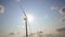 wind farms operate against the sky