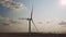 wind farms operate against the sky