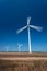 Wind Generating stations, in traffic, on a background of blue sky.