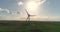 A wind generator against the background of a sunset, a wind generator on the background of the evening sunset, aerial