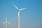 Wind generator on blue sky background.Natural energy.Windmill on sky background. renewable energy.Environmentally