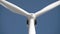 Wind generator on bright cloudy sky background