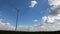 Wind generator farm time lapse with moving clouds