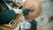 A wind instrument military parade - a man in green costume playing french horn