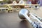 Wind instruments lying on a table against a blurred background.