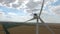 Wind mill producing electricity from wind rear view. Aerial survey. Close up