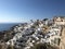 Wind mill on Santorini Island village OÃ­a with blue roofs