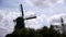 Wind mill silhouette and dramatic sky