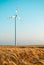 Wind power plant in wheat grain field