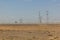 Wind power plants and electric pylons in the Gobi desert, Gansu province, Chi