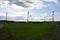 wind power plants between main road and dirt road