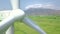 Wind power turbine generator close up. View from above flying drone windmill turbine rotating on eco energy power