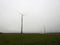 Wind power turbines in morning fog, Lithuania