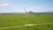 Wind Power Turbines in Wide Green Valley Aerial View