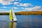 wind-powered watercraft sailing on a lake