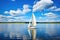 wind-powered watercraft sailing on a lake