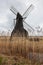 Wind pump in landscape with reed beds at Wicken Fen, Cambridgeshire, England